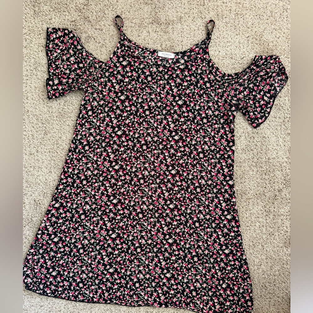 Black and rose print dress with cutout shoulders.